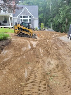 “Landscape renovation and planting services in Derry, NH, transforming an outdoor space with new trees, shrubs, flowers, and