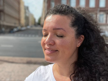 JOhanna Virtanen sitting outside eyes closed smile