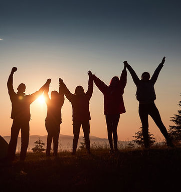 silhouette-group-people-have-fun-top-mountain-near-tent-during-sunset.jpg