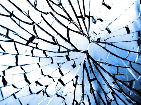 Glass that is cracked and broken but still in one piece.