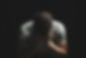 Man leaned forward, resting his face in his hands.