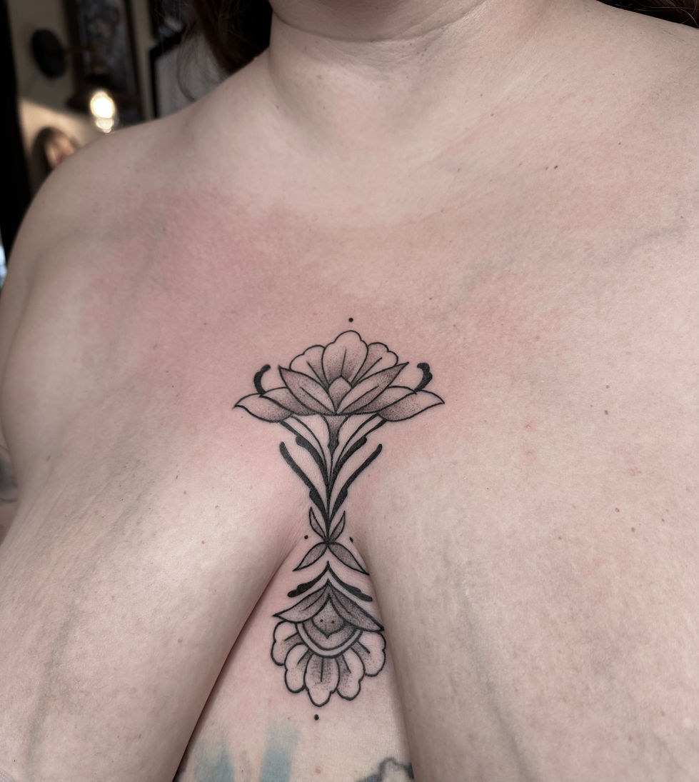 Ornate Blackwork Floral Sternum Tattoo