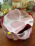 Crown of the scrub hat being divided into quarters to allow for ease of fitting.