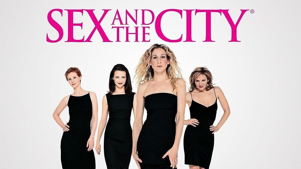 Four women in black dresses stand confidently against a white backdrop. "Sex and the City" text in bold pink above them.