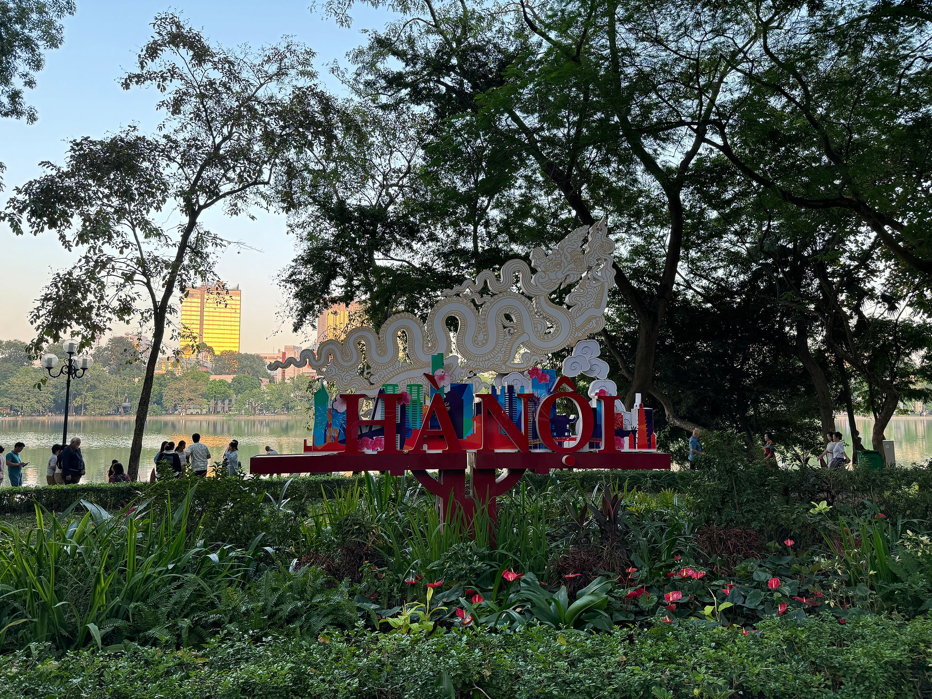 Walking along Hoan Kiem Lake in the evening