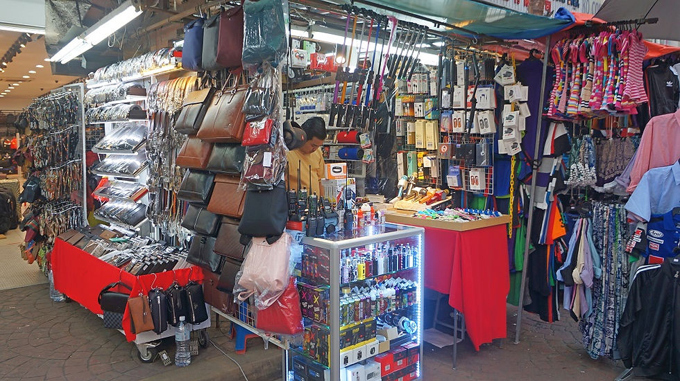 A vendor selling a variety of products at Petaling Street Market