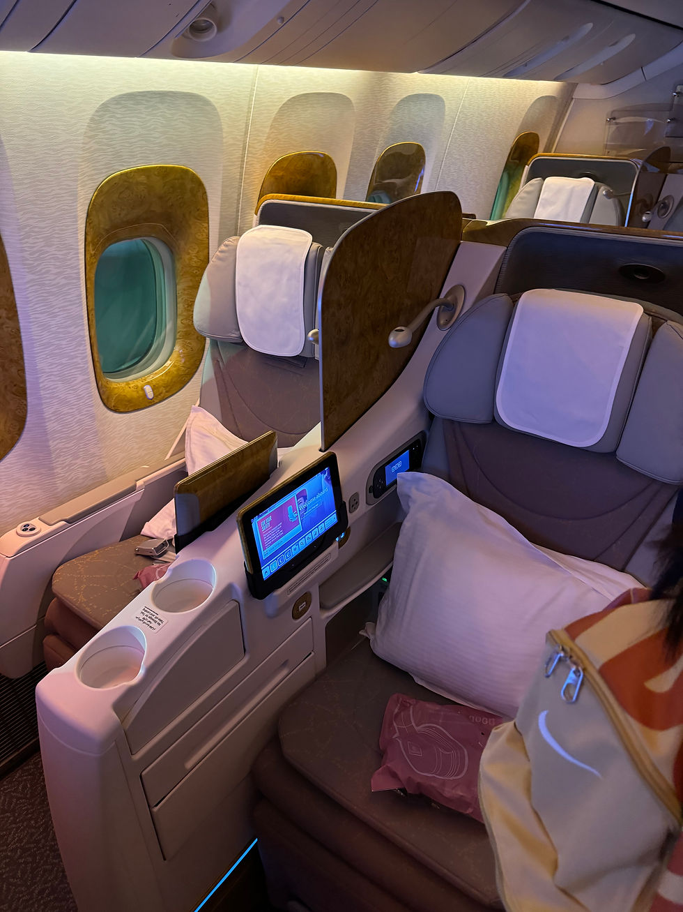 Walking past Emirates B777's Business Class section