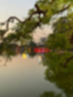 hoan kiem lake evening reflections hanoi