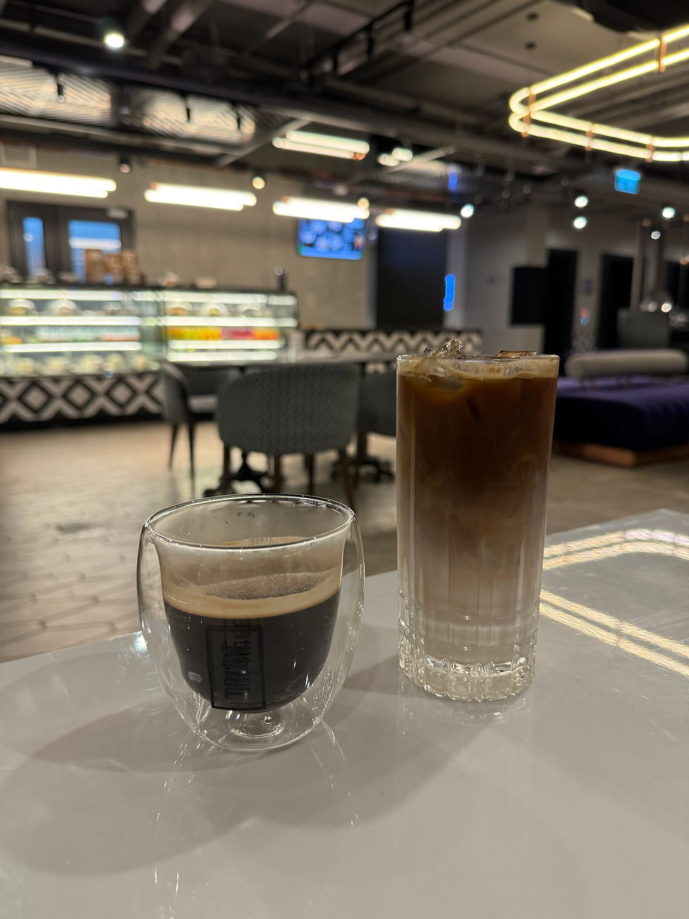Two night owls chatting away at TRIBE Phnom Penh's 24-hour lounge