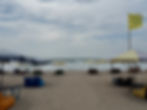 Beach umbrellas and seating area along Kuta Beach in Bali