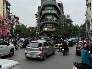 Crossing the busy roads in downtown Hanoi