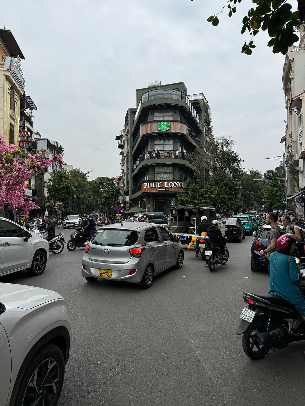 Crossing the busy roads in downtown Hanoi