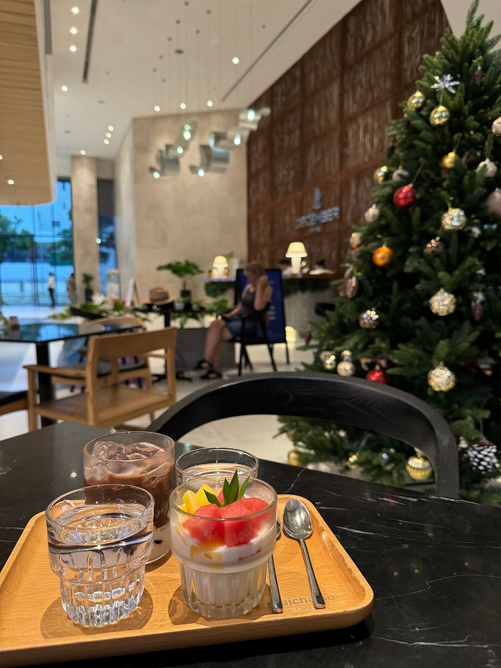 Enjoying drinks at December Hotel Maichoise Cafe