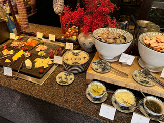 Cheese, smoked fish and cold cuts at Hotel des Arts Saigon breakfast buffet.
