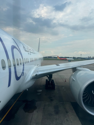 Boarding Qatar Airways B777 at Tan Son Nhat Airport towards Phnom Penh