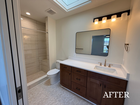 After photo of a modern bathroom renovation in Washington DC featuring new tile, updated fixtures, and a fresh, clean design by 4K Group LLC.