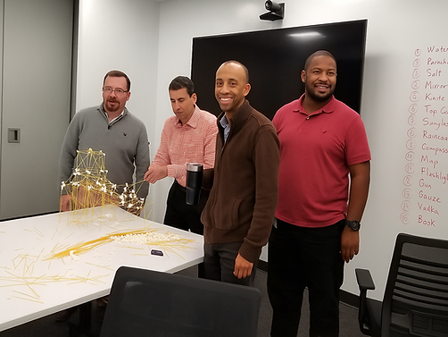 diverse team (in conference room) during teambuilding