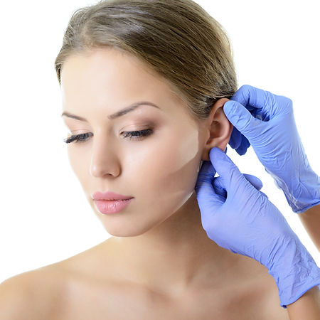 Young woman face with beauty treatment e