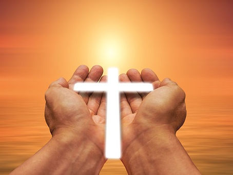 Hands holding the Cross