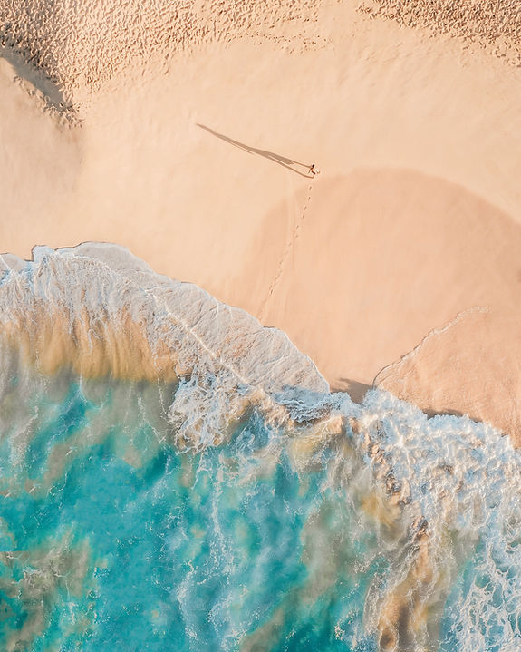 Aerial view of ocean waves at a beach 