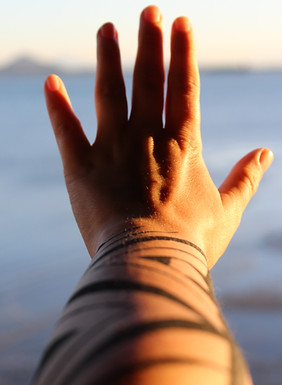 Hand with indigenous paintings