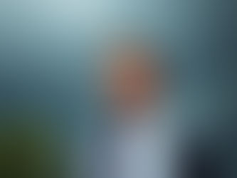 A resilient leader standing strong against stormy skies.