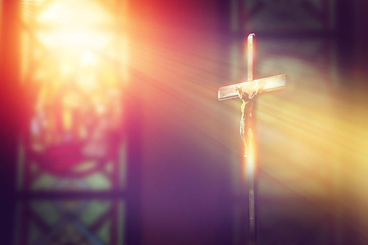 stock-photo-crucifix-jesus-on-the-cross-in-church-with-ray-of-light-from-stained-glass-103