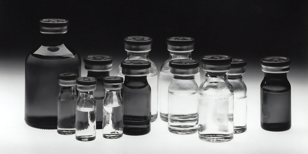Black and white photo of peptide vials lined up in a row