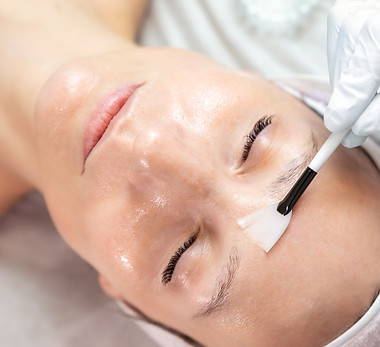 Close-up beautician doctor hand making anti-age procedure apply peeling acid young attract