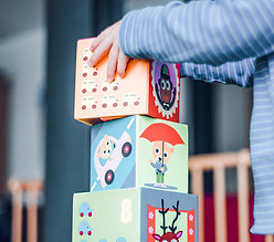 Kid hands on large blocks.JPG