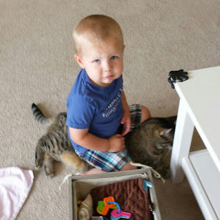 Zachary "practicing" on his gentleness with Olivia.