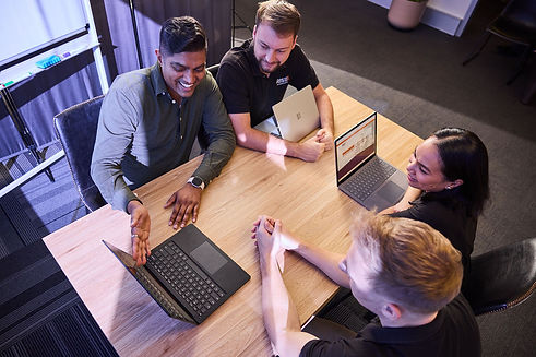 The team of friendly and experienced accountants in Brisbane talking about business plans and how to improve financial performance for businesses