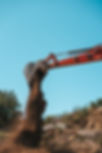 closeup-of-a-backhoe-with-dirt-against-sky-2024-11-25-12-06-38-utc.jpg
