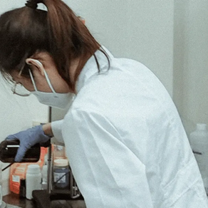 Charlotte, co-founder and chemist of Vase Creation formulating in the lab.