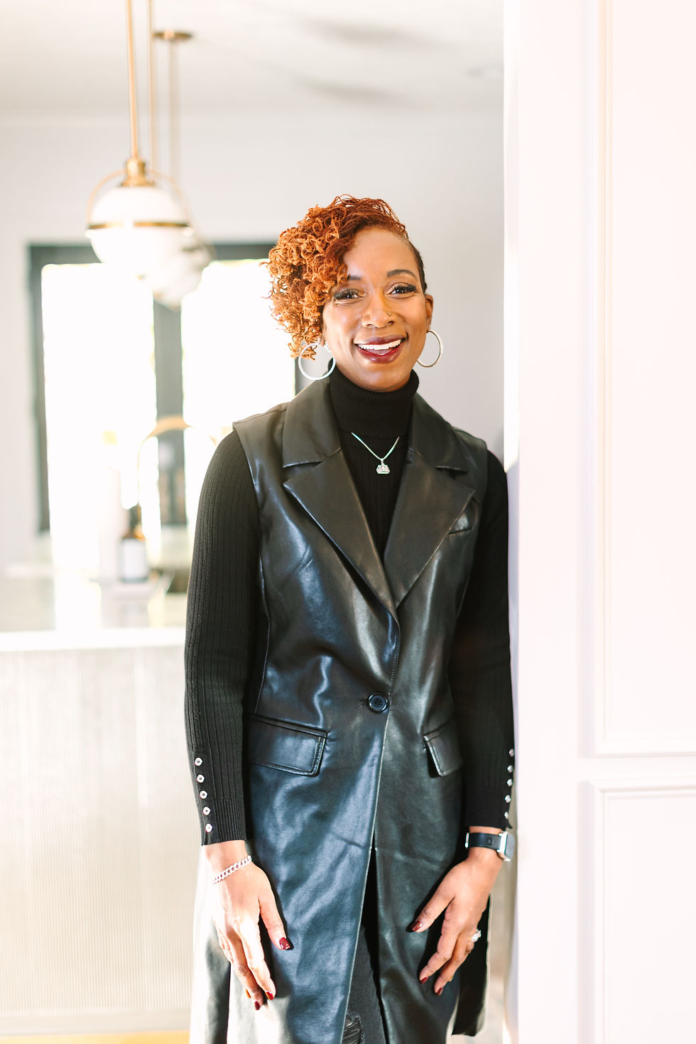 friendly African american woman smiling in a doorway