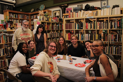 Prison Library Project volunteers gathered together, smiling and talking during a volunteer celebration.