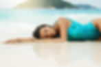 Woman Laying on Beach