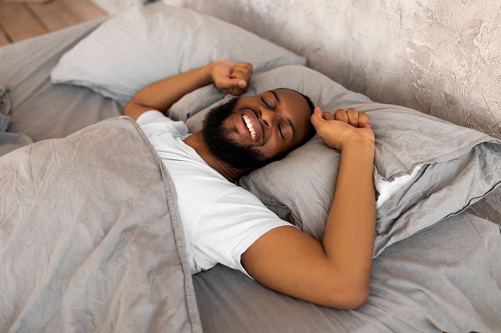 Black bearded man sleeping in bed