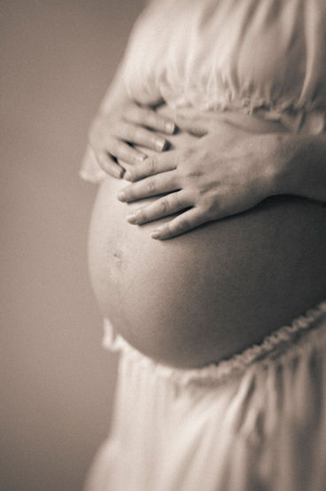 Intimate bare belly maternity photography in Chapel Hill, North Carolina.