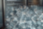 pile-ice-cubes-is-piled-up-front-silver-machine.jpg
