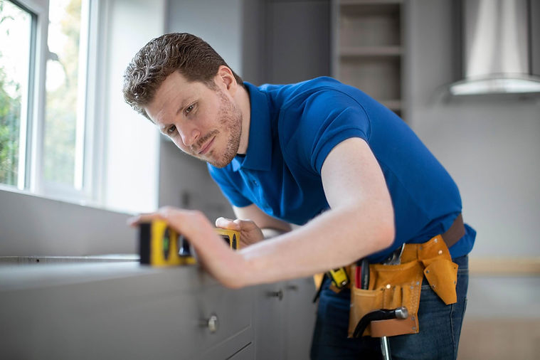 Carpenter installing kitchen.jpg