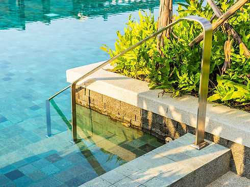 Long, distinctive pool handrails and steps