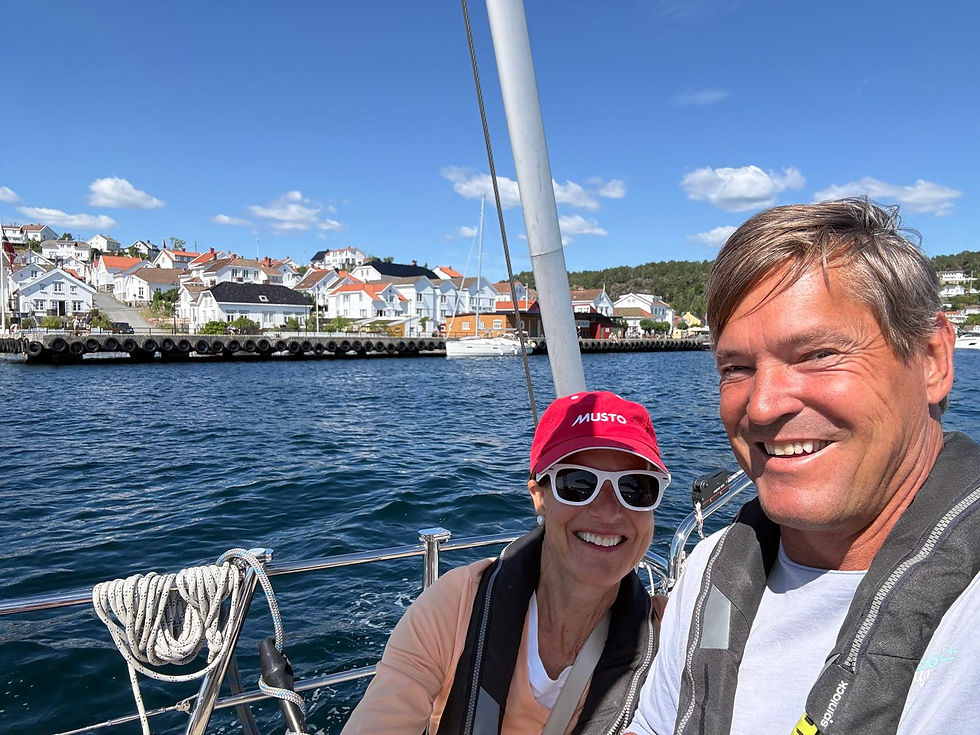 Beth and Gero onboard the Star Mist with a Norwegian city in the background
