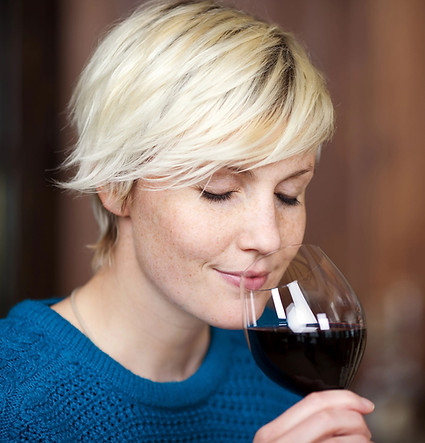 woman sniffing wine