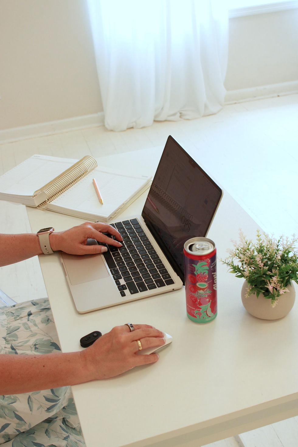 Linds Paulson's hands typing on a laptop