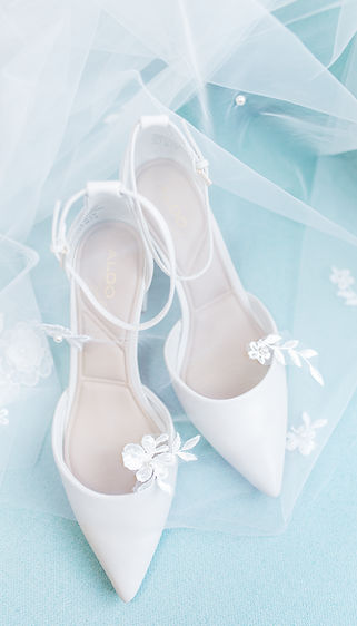 Tangled Roots Leduc Bridal shoes detail shot with veil on sky blue background for Edmonton wedding planned by Soul Ties by Design