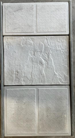 Mixed texture panel with smooth and stone-like surfaces.