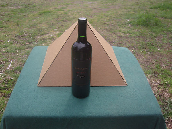 The Giza Fold-up Cardboard Pyramd with a bottle of wine for comparison.