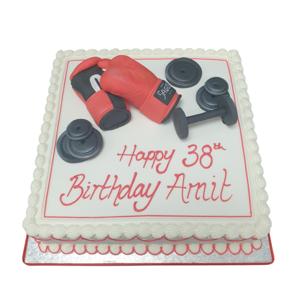 Square cake decorated with gym equipment and weights, perfect for fitness enthusiasts.