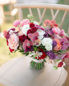 bridal bouquet rests on chair